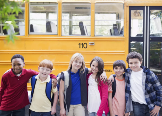 kids in front of a bus
