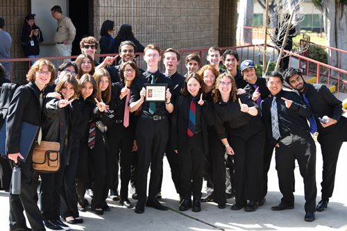 Tesoro HS Jazz Ensemble wins first place. Students standing with plaque.