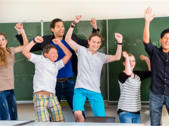 a group of people in front of a blackboard
